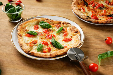 Neapolitan-style pizza. Pizza Margherita thin crust, fresh ingredients, and high edges. Pizza Napoletana