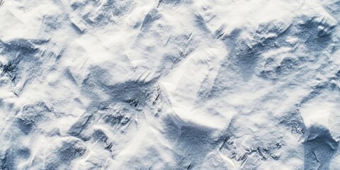 Obraz premium Closeup view from above featuring the soft white texture of freshly fallen snow with gentle ridges and patterns on a cold winter surface