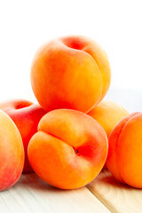 apricot on white wood background