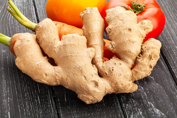 ginger on black wood background