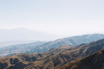 Layers of  misty mountains across the horizon during sunset, Joshua park, California.
