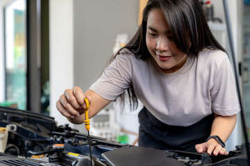 A woman checks her car before traveling