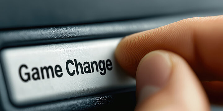 A finger presses a button with text Game Change. Game changer creative concept. Rule change, leader, self-expression