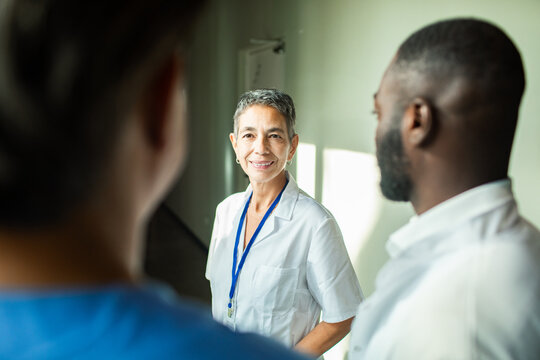 Medical team discussing patient care in hospital lobby