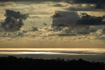 sunset over the Tyrrhenian Sea during a spring day with a cloudy sky, seen from Maierà, Cosenza