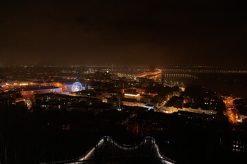 Fototapeta premium Beautiful View of the Dnieper river, River station, Havana bridge and Naberezhno-Kreschatitska street in Kiev, Ukraine. Night panorama of Kyiv