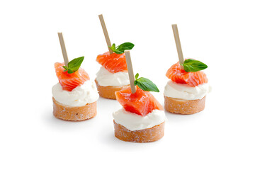 Canapes with red salmon and cream cheese isolated on white background