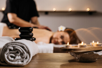 A woman gets a back massage with oil at a spa. Massage therapist, uses aromatherapy oil. Concept of...