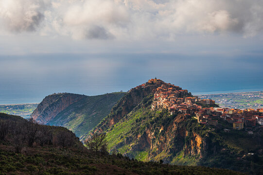 top view of the village of Grisolia with a cloudy sky in the background, Cosenza
