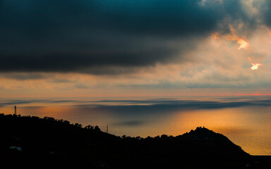 sunset over the Tyrrhenian Sea during a spring day with a cloudy sky, seen from Maierà, Cosenza