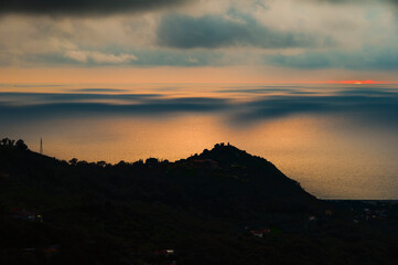 sunset over the Tyrrhenian Sea during a spring day with a cloudy sky, seen from Maierà, Cosenza