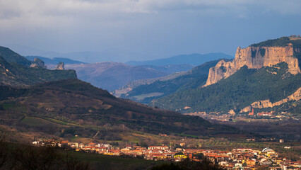 Obraz premium top view of the village of Grisolia with a cloudy sky in the background, Cosenza