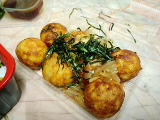 Delicious Takoyaki with Seaweed Garnish, Takoyaki Ball,Japanese Food in transparent plastic box