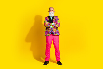 Photo of serious old man showman standing wear glamour outfit cross arms isolated yellow color background