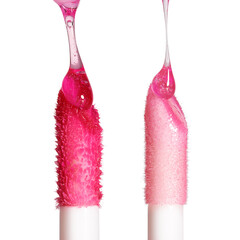 Two lip gloss applicators. Drops of liquid lip gloss falls on applicators. Closeup shot, isolated...