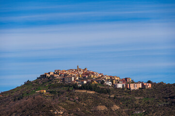 top view of the village of Grisolia with a cloudy sky in the background, Cosenza