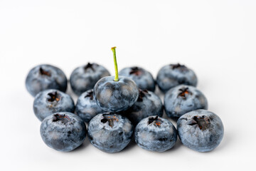 close-up of blueberries on white background