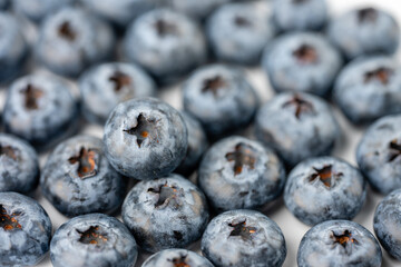 close-up of blueberries on white background
