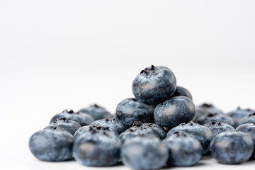 close-up of blueberries on white background