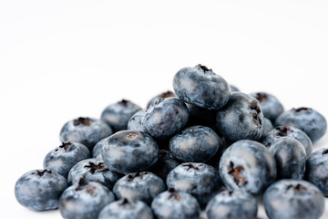 close-up of blueberries on white background