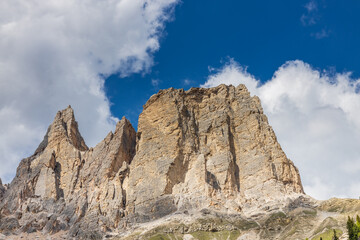 Dolomites rocky summits in the Alps. High tower peaks and sharp mountain rocky peaks of the Alps in the Dolomiti region, Italy. Beautiful scenic mountain range landscape in summer