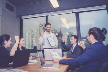 Group business people team meeting together while man presenting and explaining about planning and strategy marketing in modern office, brainstorming and collaboration of teamwork, business concept.