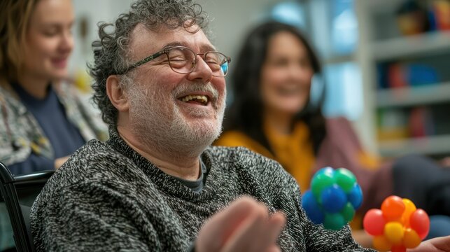 A mentally disabled adult in a supportive environment, engaging in a fun group activity