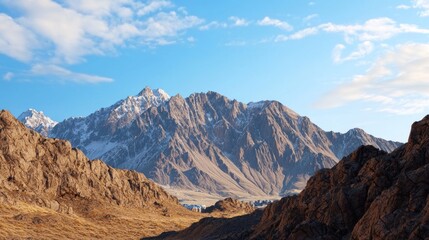 Majestic mountain landscape under a clear blue sky.
