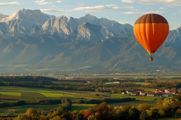 Obraz premium A vibrant hot air balloon floats over a picturesque valley with mountains in the background.