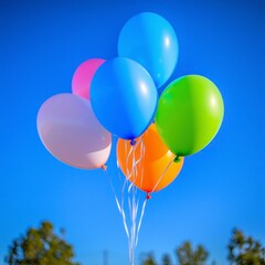 Obraz premium Colorful Balloons Floating in Blue Sky Party Celebration Festive