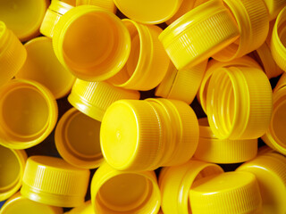 yellow plastic bottle caps.Recycling collection and production processing plastic bottle caps...