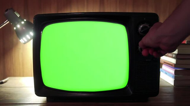 Hand Switching On Green-Screen Television - Close Up - Zoom In - 100% Real Video, Not AI Generated - 4K