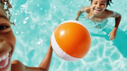 Joyful kids playing with a beach ball in a sparkling pool under the sun