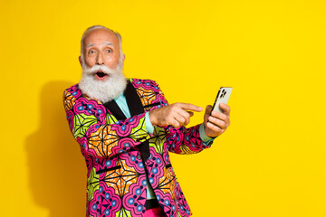 Photo of handsome pensioner mister amazed hold gadget dressed stylish colorful pink classy garment...