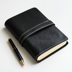 Elegant black leather journal with a sleek pen on a clean surface inviting creativity and reflection
