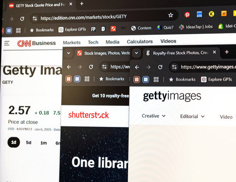 Paris, France - Jan 11, 2025: Close-up of open browser tabs displaying stock image websites including Getty Images and Shutterstock, alongside financial data