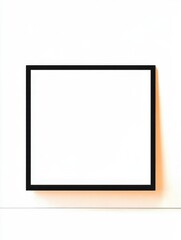 This image features a minimalistic black frame placed on a bright white wall, ideal for showcasing art or photographs in an elegant and clean manner.
