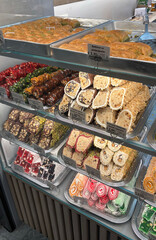 Showcase with assorted oriental sweets, featuring vibrant colors and intricate details, perfect for food promotions, menus, or cultural themes