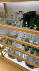 Shop window display featuring elegant dishes and tableware, ideal for advertising kitchenware, home decor