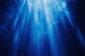 Obraz premium Ethereal Light Rays Cascading through Deep Water