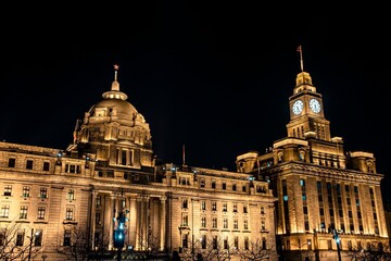 Fototapeta premium Illuminated historic building at night in Shanghai.