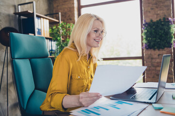 Photo of happy cheerful lady ceo dressed shirt reading modern gadget holding papers indoors...
