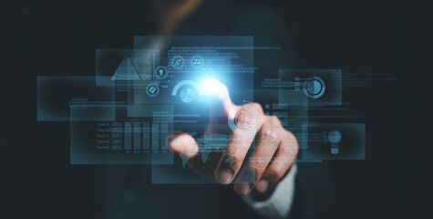 businessman on document planning the business plans and analyse  profitability of working companies with digital augmented virtual graphics for project manager working on laptop and update information