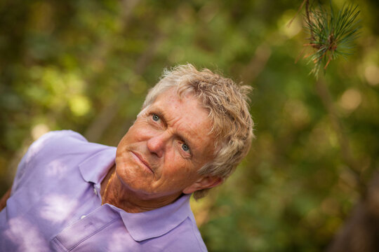 A portrait of an older handsome man outside in the Swedish nature