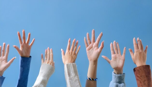 An image emphasizing citizen participation, with many people raising their hands in the air