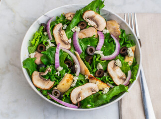 salad with  chicken, black olives, goat cheese,  and mushrooms