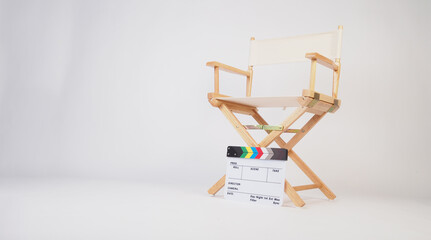 Director chair with clapper board on white background.