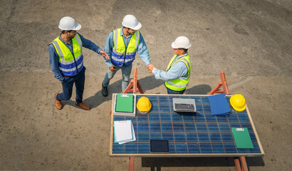 Portrait of Engineer or foreman team meeting with cargo container background at sunset. Logistics global import or export shipping industrial concept.