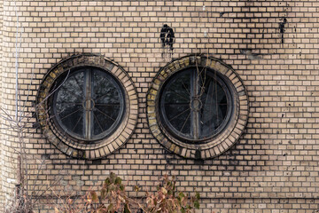 An old abandoned building with strange round windows