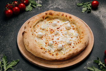Delicious gourmet pizza with melted cheese and mozzarella balls, baked to golden perfection
